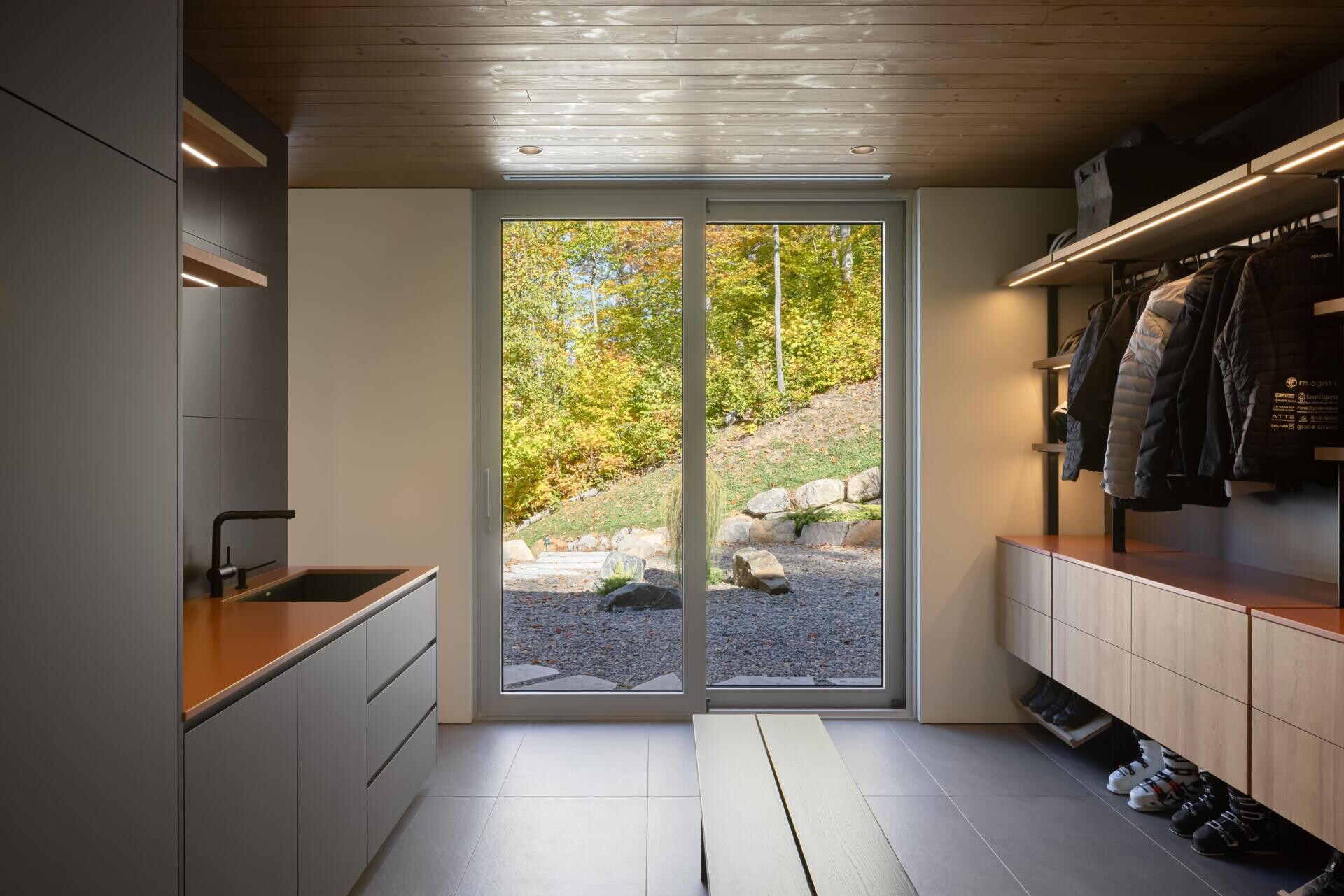 This oversized mudroom combines practical storage with warm modern design for life in Québec’s mountain landscape.